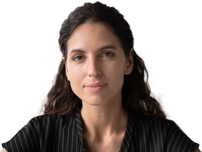 Image of woman with dark brown hair, wearing a black and white striped button-down t-shirt