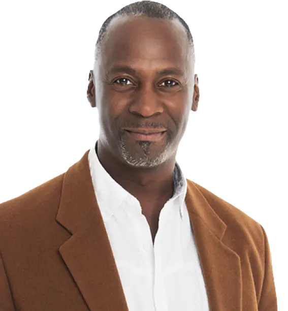 Image of man in a brown blazer and white button-up shir